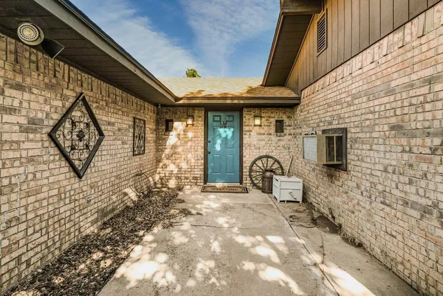 a front view of a house with parking area