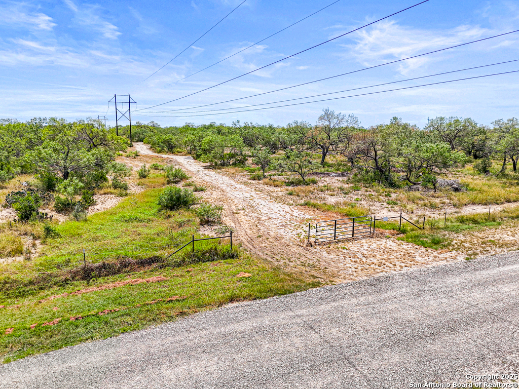 0 Pr Riley Poteet, TX 78065 - Photo 10 of 11 a view of a yard with an empty space and a yard