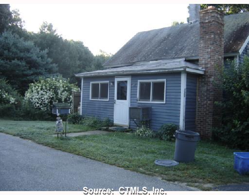123 Lynch Road Lebanon, CT 06249 - Photo 1 of 1 a front view of a house with a yard