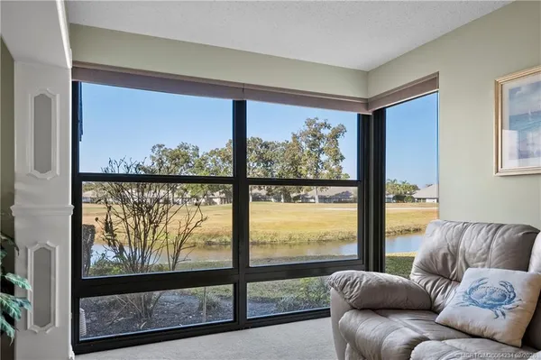 a living room with glass windows
