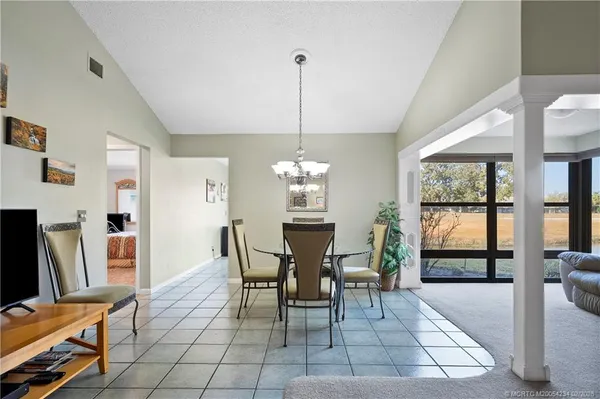 a view of a dining room with furniture window and outside view