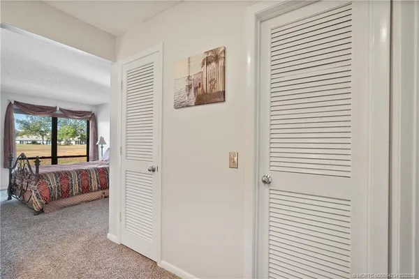 a view of bedroom with window