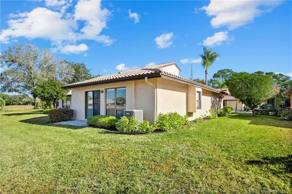 a view of a house with garden and yard