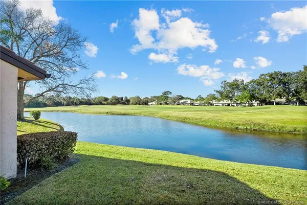 a view of a lake with a big yard