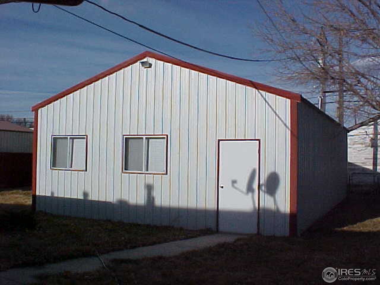 423 2nd Street Kersey, CO 80644 - Photo 2 of 2 a house view with a backyard