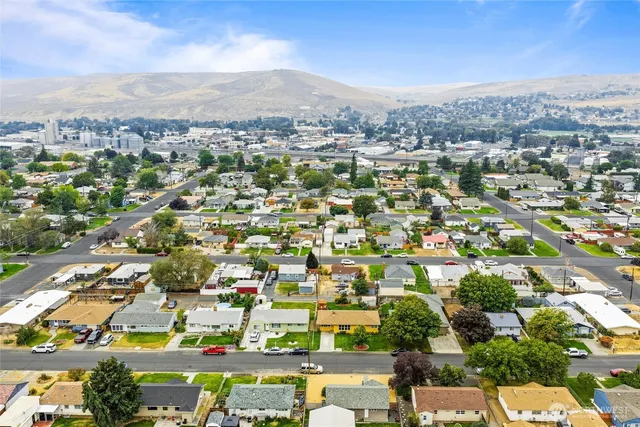 an aerial view of residential houses with outdoor space