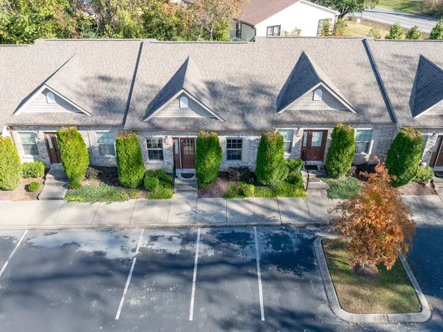 a aerial view of a house and a yard