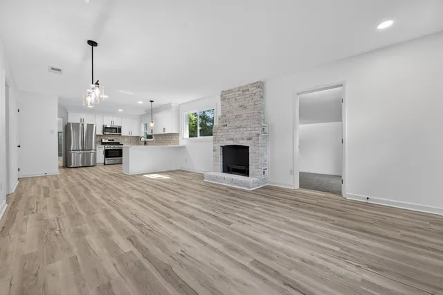 a view of a kitchen with a sink and an oven
