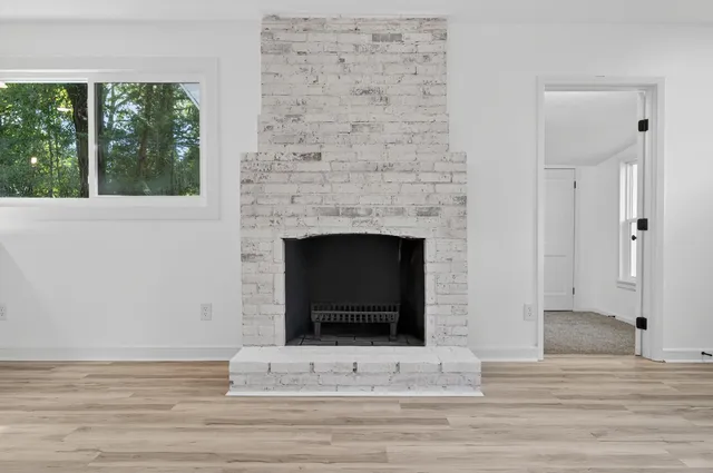a kitchen with a refrigerator and a stove top oven