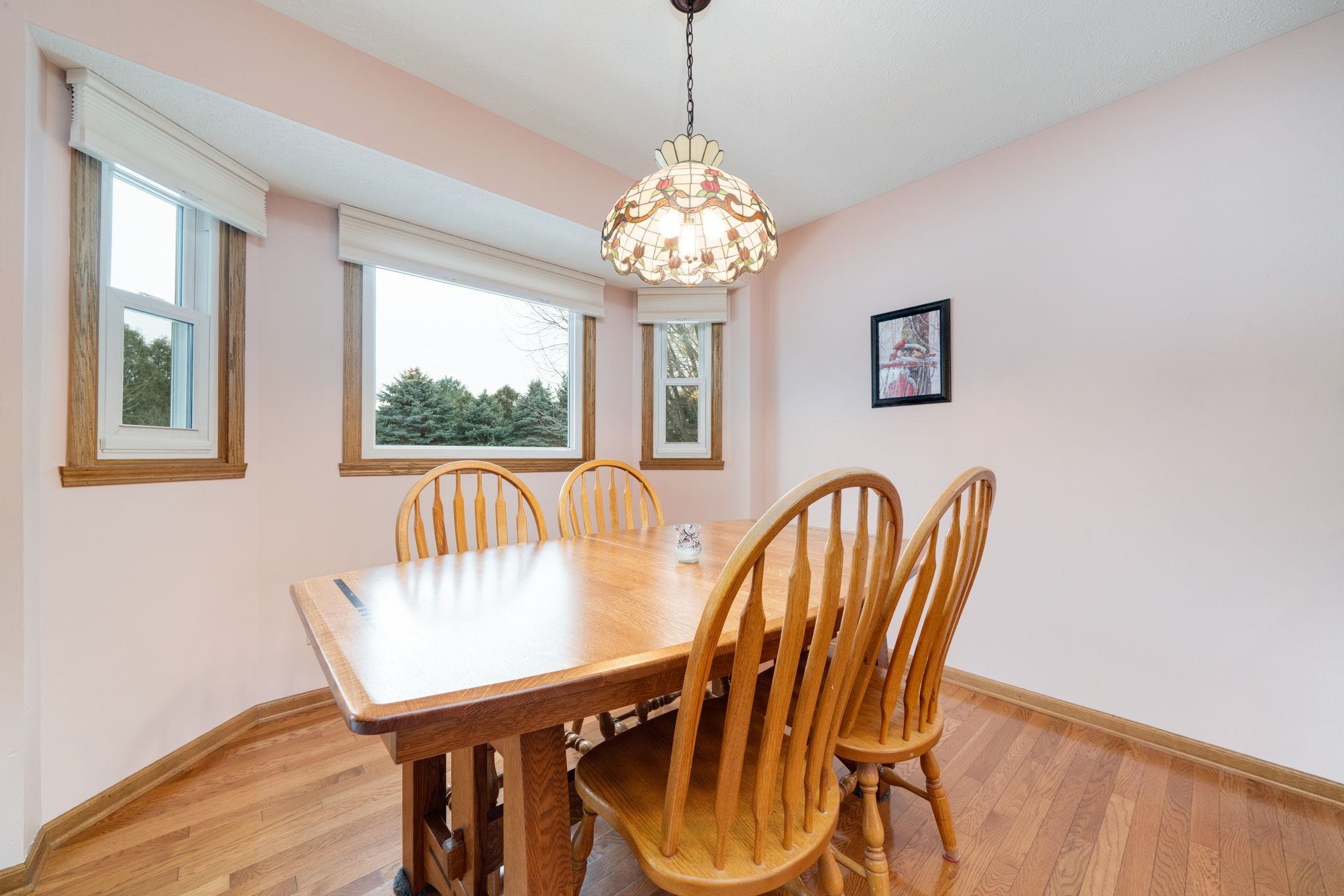 6395 Greystone Roscoe, IL 61073 - Photo 15 of 32 a view of a dining room with furniture window and outside view