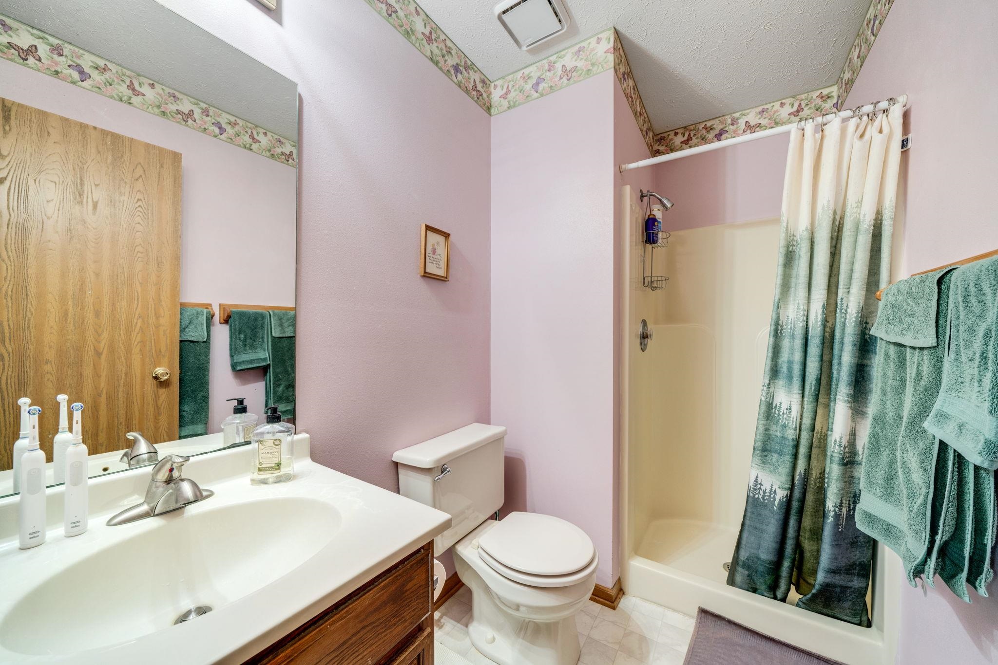 6395 Greystone Roscoe, IL 61073 - Photo 19 of 32 a bathroom with a sink toilet and shower