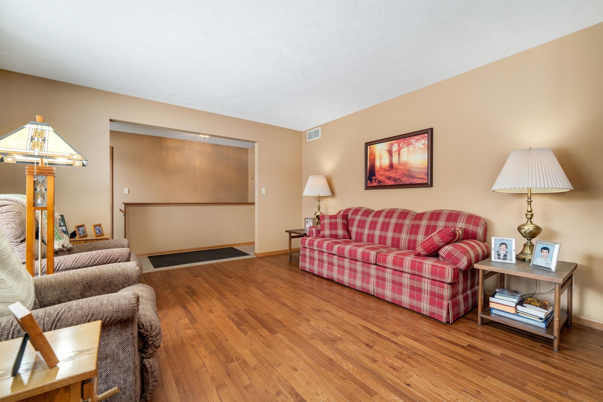 6395 Greystone Roscoe, IL 61073 - Photo 7 of 32 a bedroom with a bed and a couch