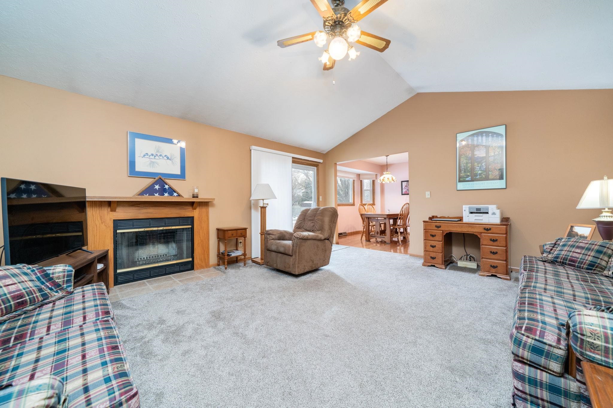 6395 Greystone Roscoe, IL 61073 - Photo 9 of 32 a living room with furniture and a fireplace