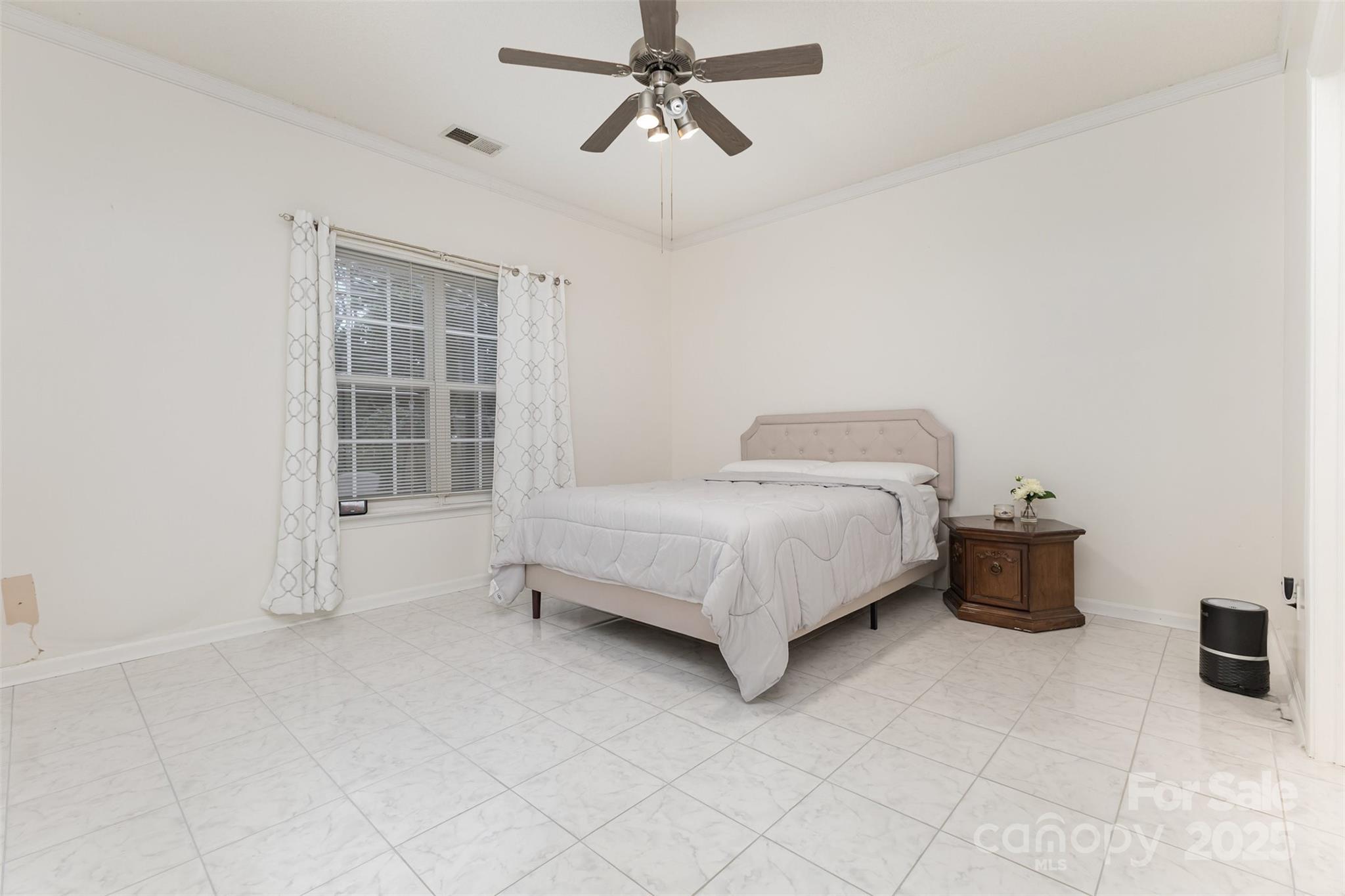 13521 Michael Lynn Road Charlotte, NC 28278 - Photo 19 of 34 a bedroom with a bed and a window