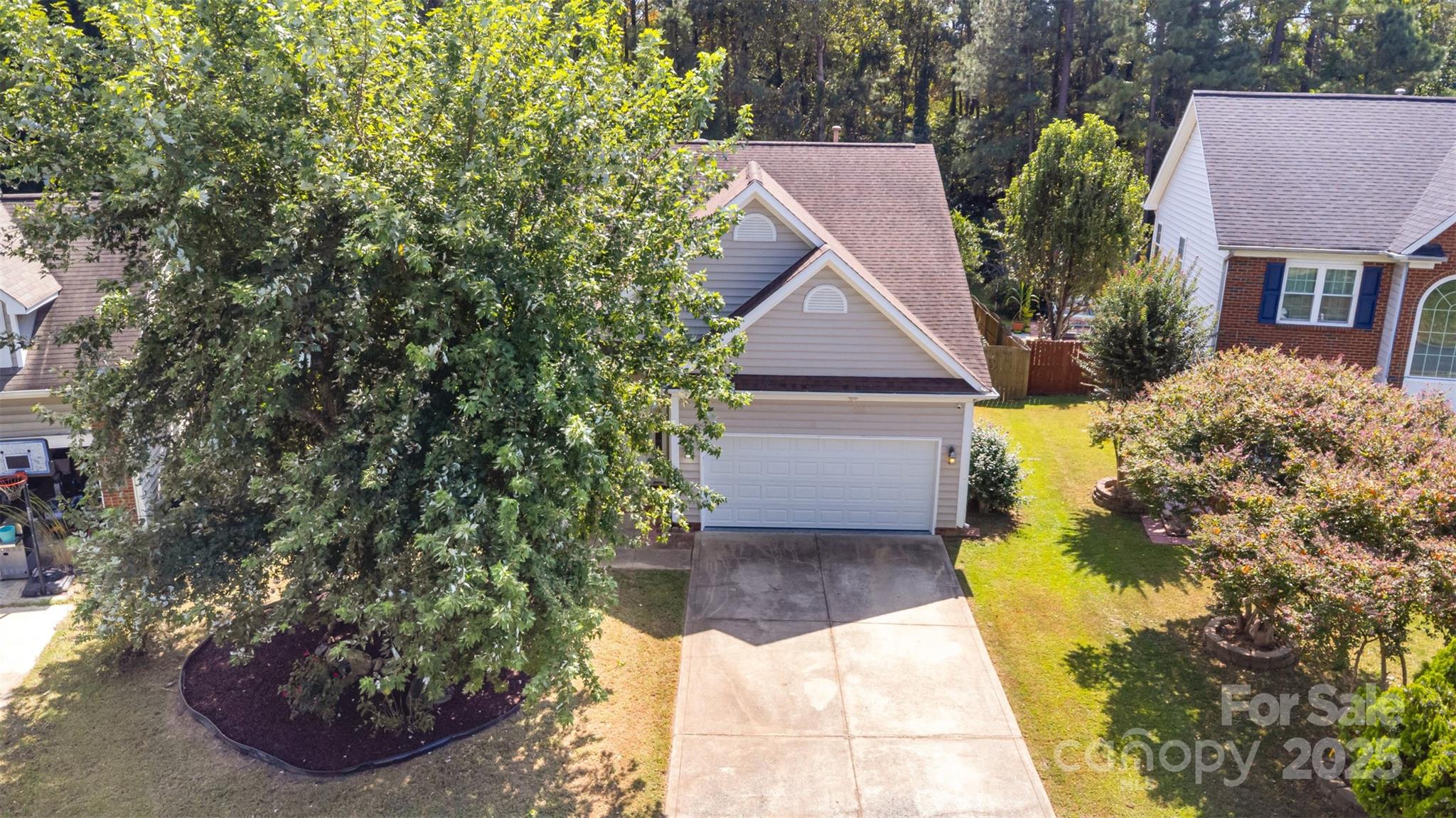 13521 Michael Lynn Road Charlotte, NC 28278 - Photo 2 of 34 a aerial view of a house with a yard and potted plants