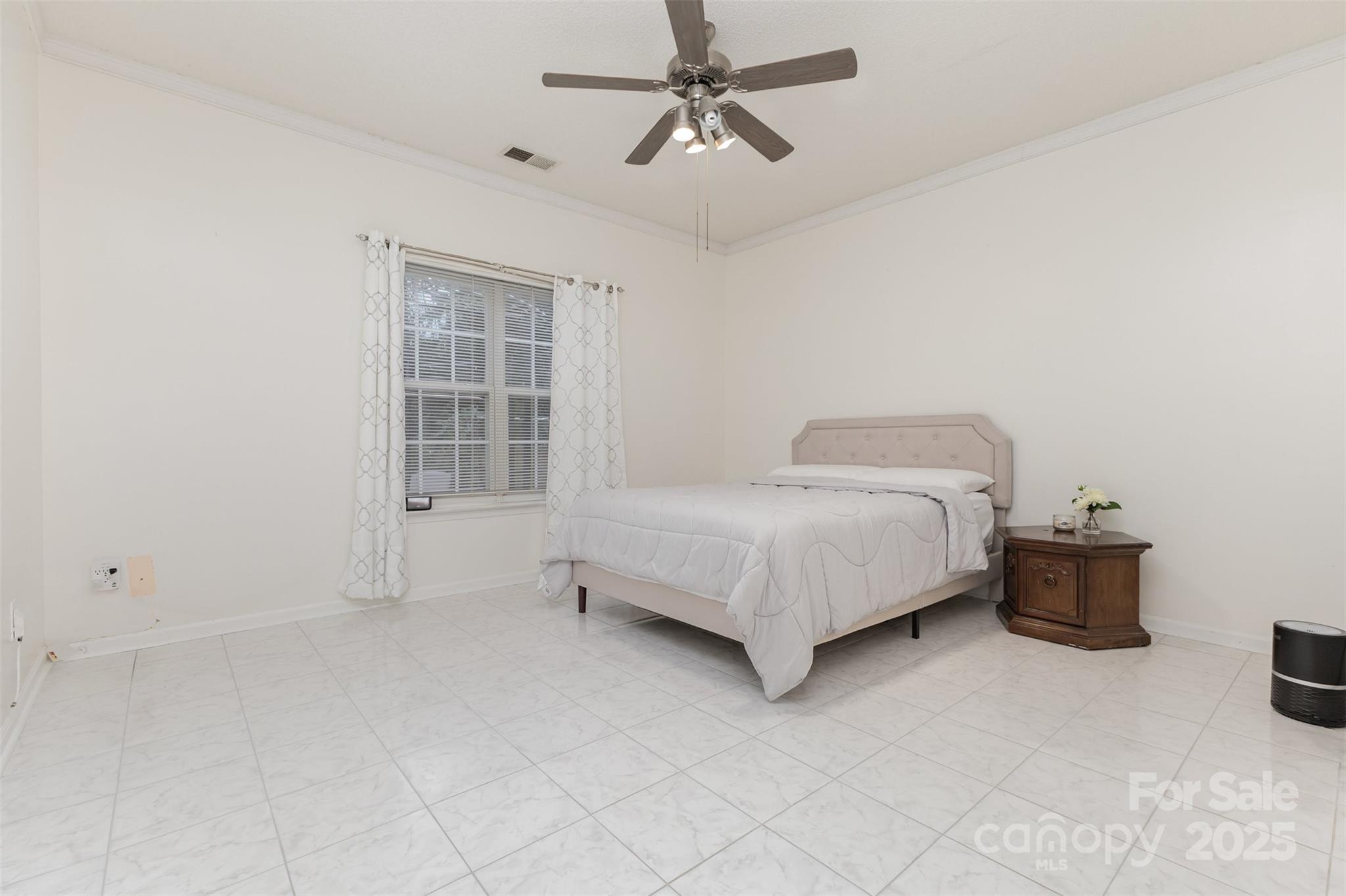 13521 Michael Lynn Road Charlotte, NC 28278 - Photo 21 of 34 a bedroom with a bed and window