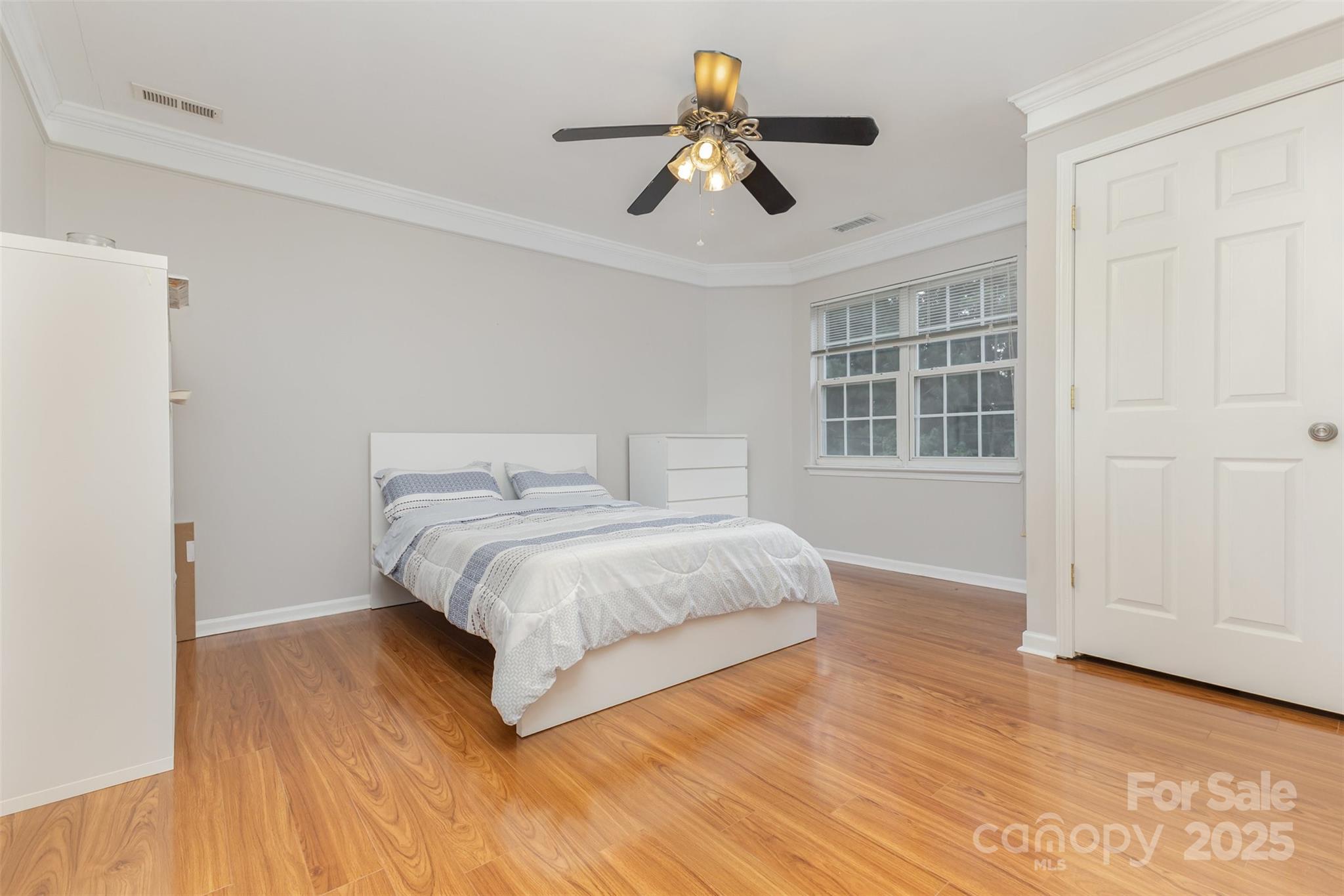 13521 Michael Lynn Road Charlotte, NC 28278 - Photo 25 of 34 a bedroom with a bed and wooden floor