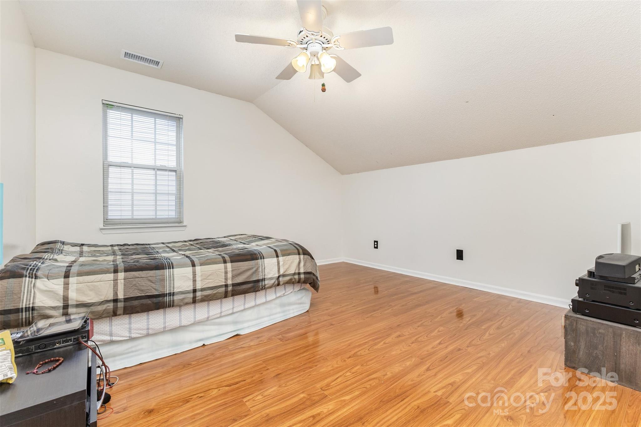 13521 Michael Lynn Road Charlotte, NC 28278 - Photo 26 of 34 a bedroom with a bed and wooden floor