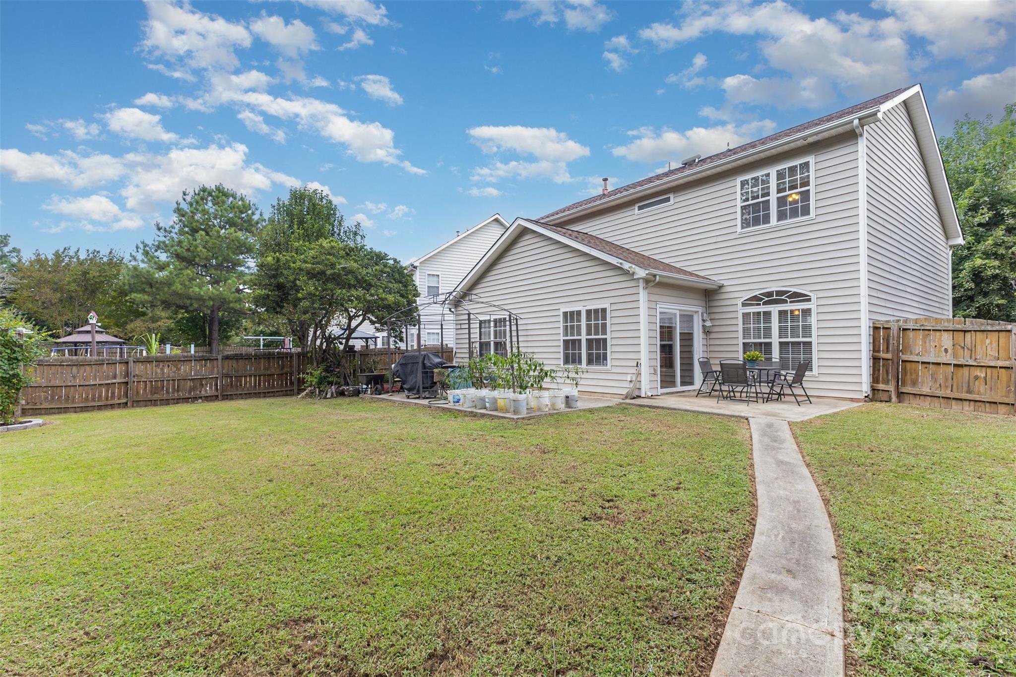13521 Michael Lynn Road Charlotte, NC 28278 - Photo 29 of 34 a view of a house with a yard