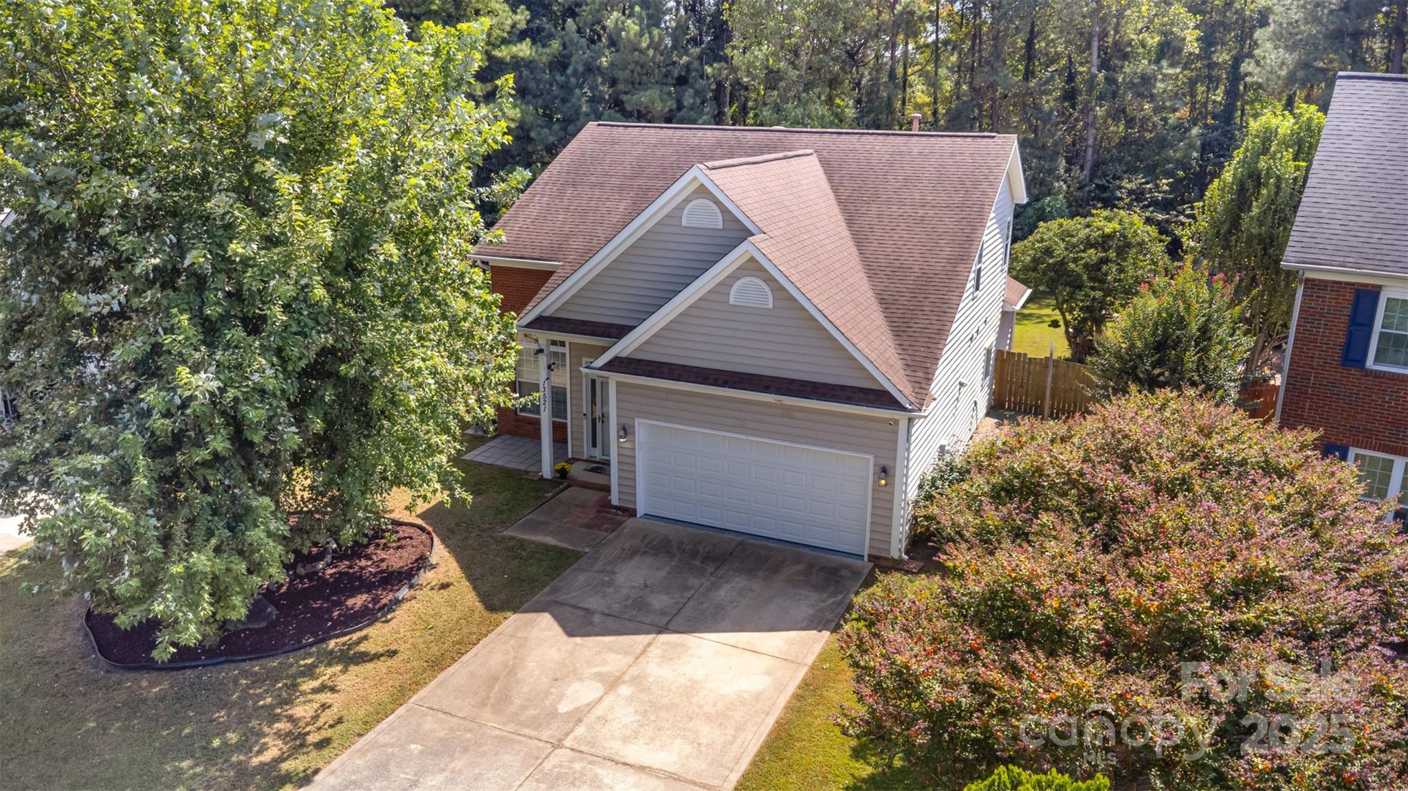 13521 Michael Lynn Road Charlotte, NC 28278 - Photo 3 of 34 a view of a house with a yard plants and large tree