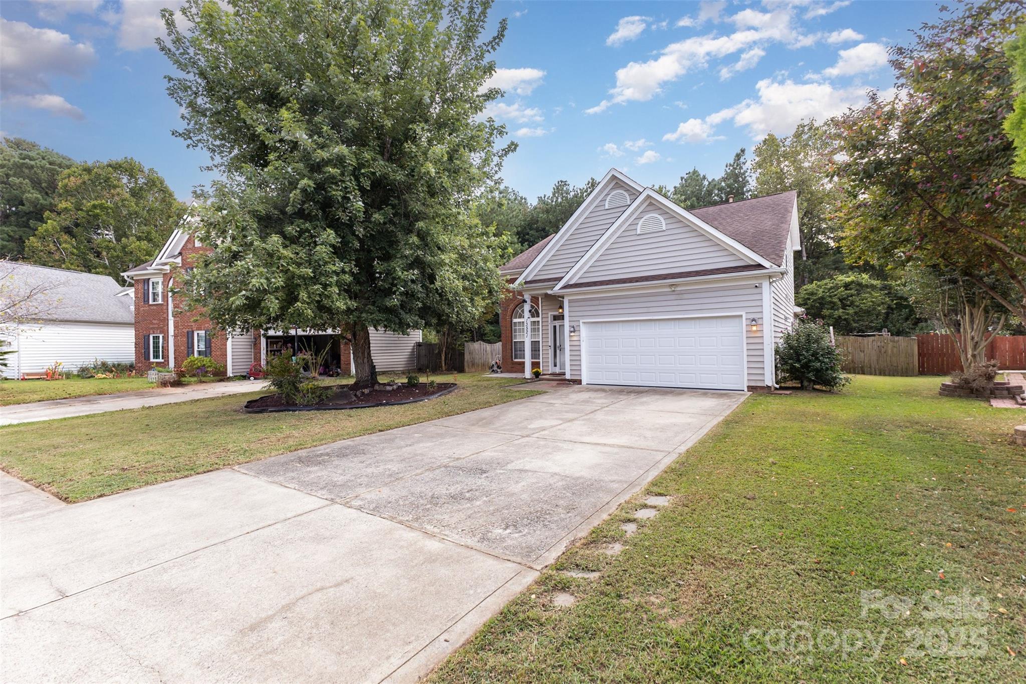 13521 Michael Lynn Road Charlotte, NC 28278 - Photo 4 of 34 a front view of a house with a yard and garage