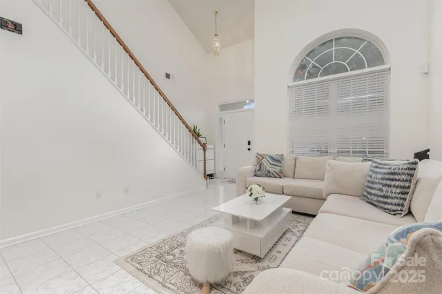 a living room with furniture and a rug