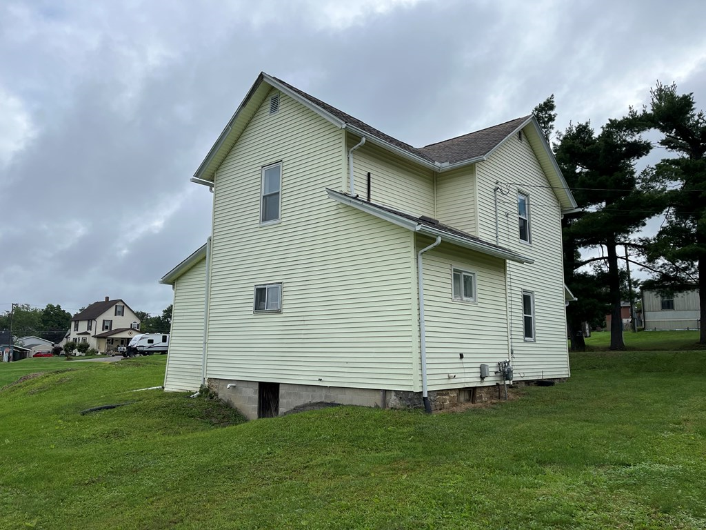115 Shady Lane Seneca, PA 16346 - Photo 3 of 4 a front view of a house with a garden