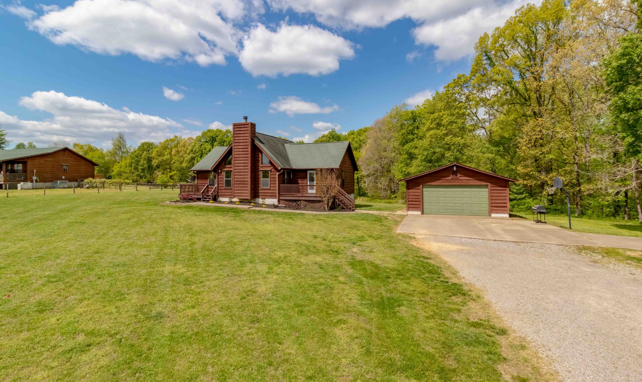 946 Hayes Ridge Road Indian Mound, TN 37079 - Photo 2 of 23 a view of a house with a yard and garage