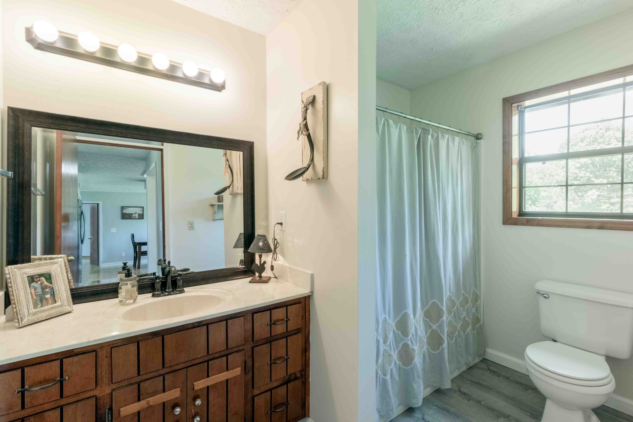 946 Hayes Ridge Road Indian Mound, TN 37079 - Photo 13 of 23 a bathroom with a double vanity sink toilet and a mirror