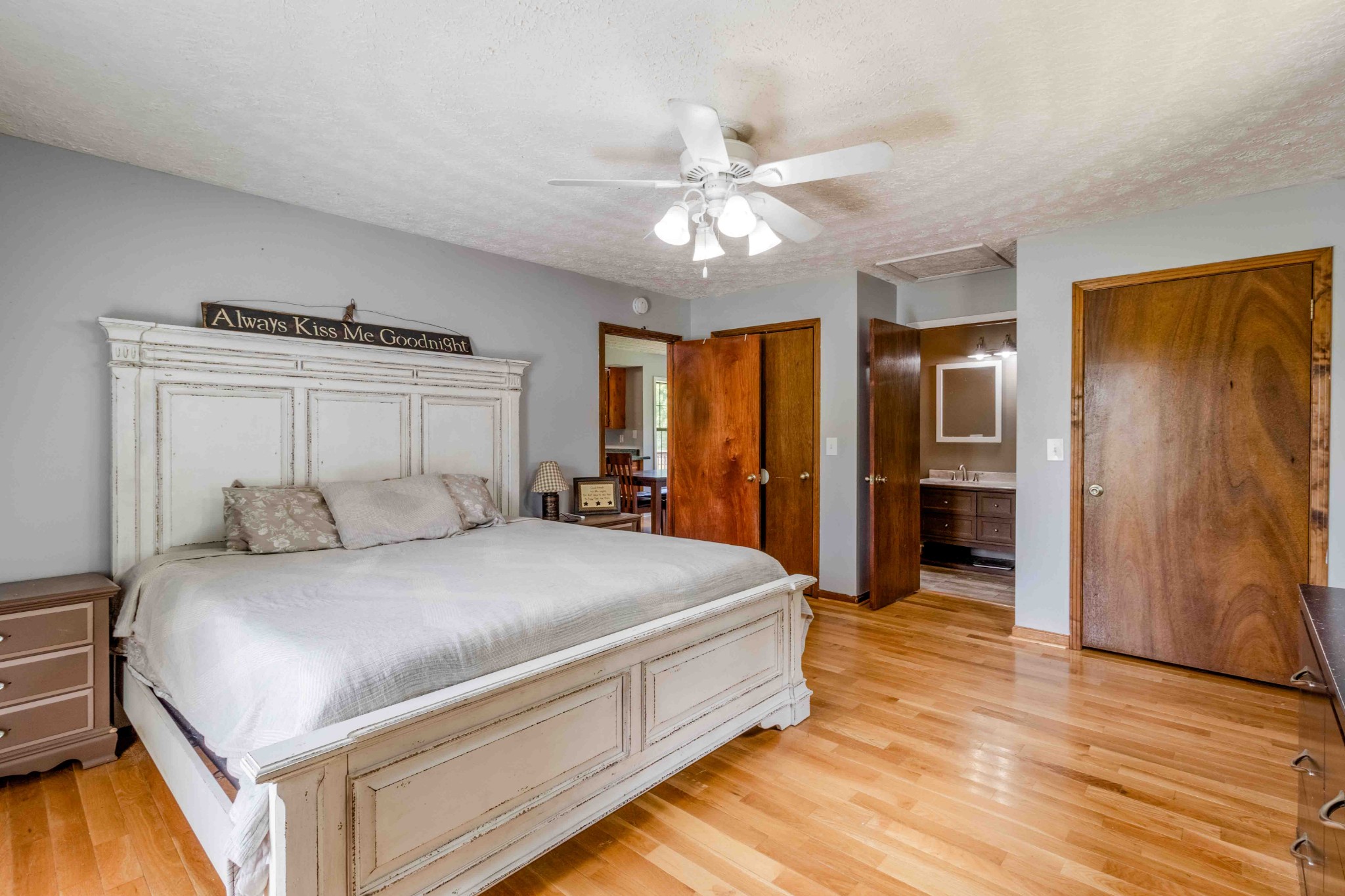 946 Hayes Ridge Road Indian Mound, TN 37079 - Photo 15 of 23 a bedroom with a large bed and a chandelier