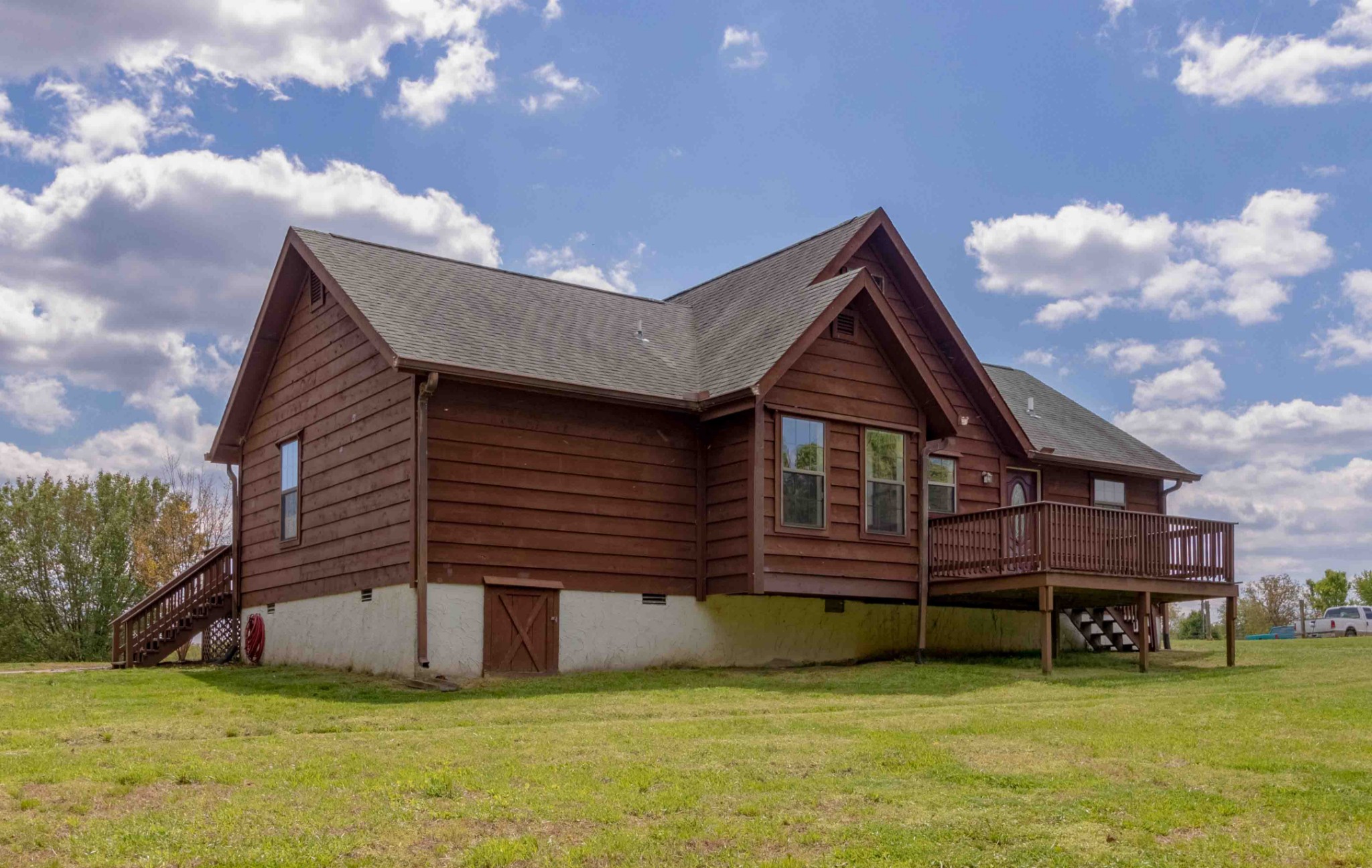 946 Hayes Ridge Road Indian Mound, TN 37079 - Photo 19 of 23 a front view of a house with a garden and deck