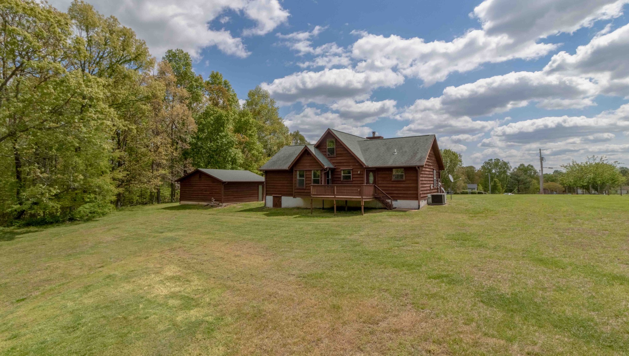 946 Hayes Ridge Road Indian Mound, TN 37079 - Photo 21 of 23 a wooden bench sitting in middle of a field