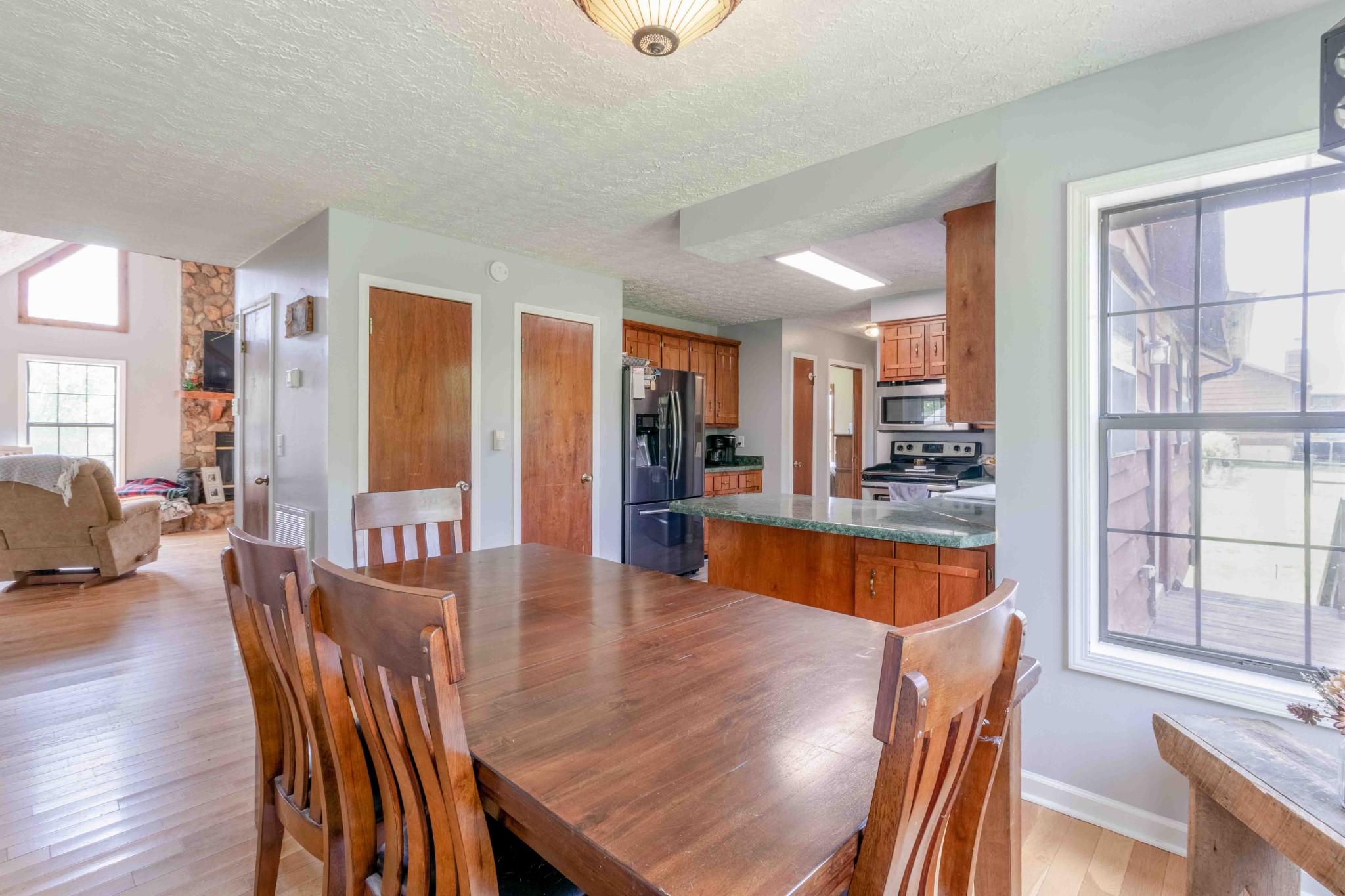 946 Hayes Ridge Road Indian Mound, TN 37079 - Photo 10 of 23 a view of a dining room with furniture window and wooden floor