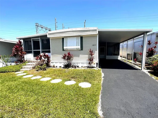 a view of house with outdoor seating space