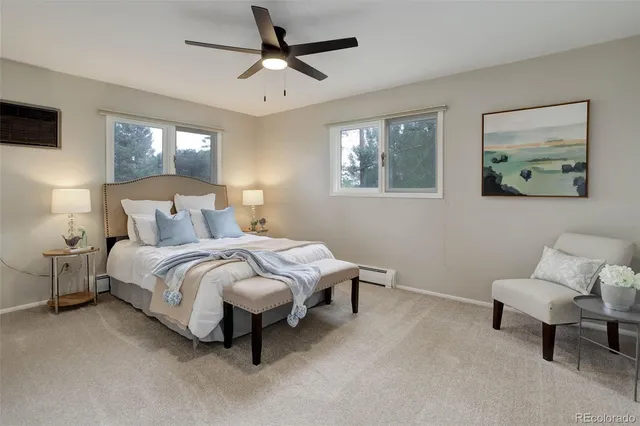 a spacious bedroom with a bed and a window