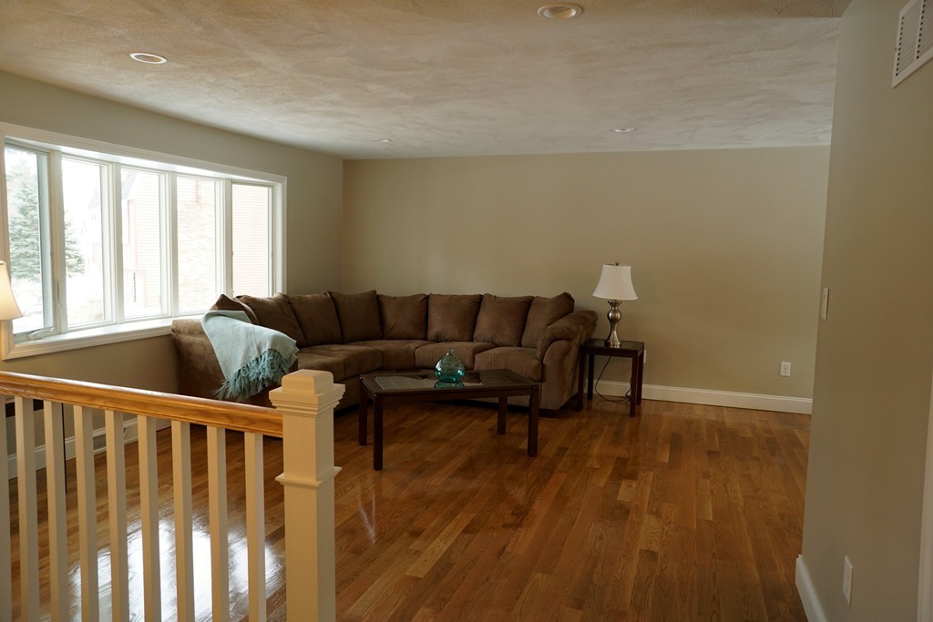 38 Blanchard Road Wilmington, MA 01887 - Photo 11 of 21 a living room with furniture and wooden floor