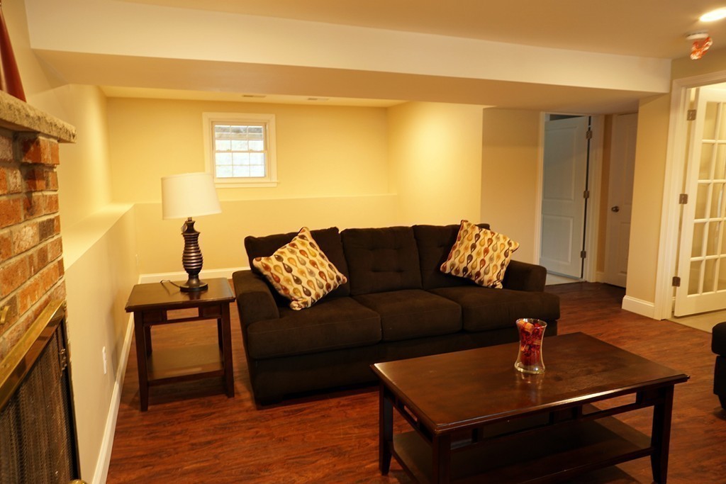 38 Blanchard Road Wilmington, MA 01887 - Photo 15 of 21 a living room with furniture and wooden floor