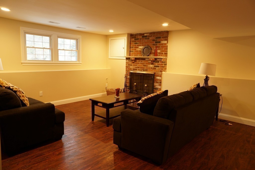 38 Blanchard Road Wilmington, MA 01887 - Photo 16 of 21 a living room with furniture and a fireplace
