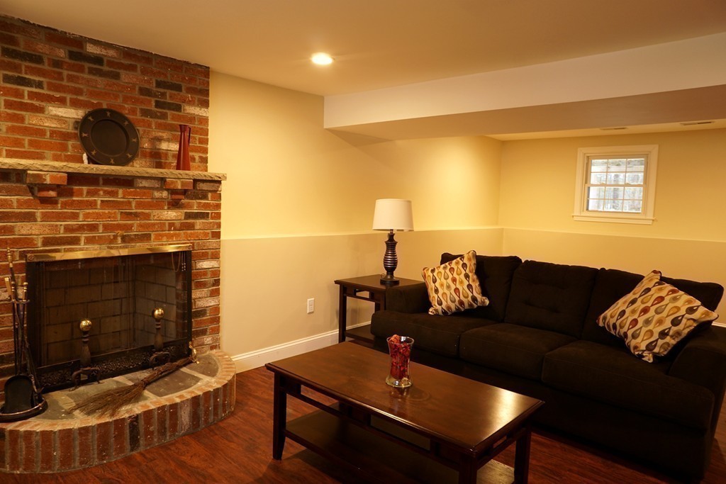 38 Blanchard Road Wilmington, MA 01887 - Photo 17 of 21 a living room with furniture and a fireplace