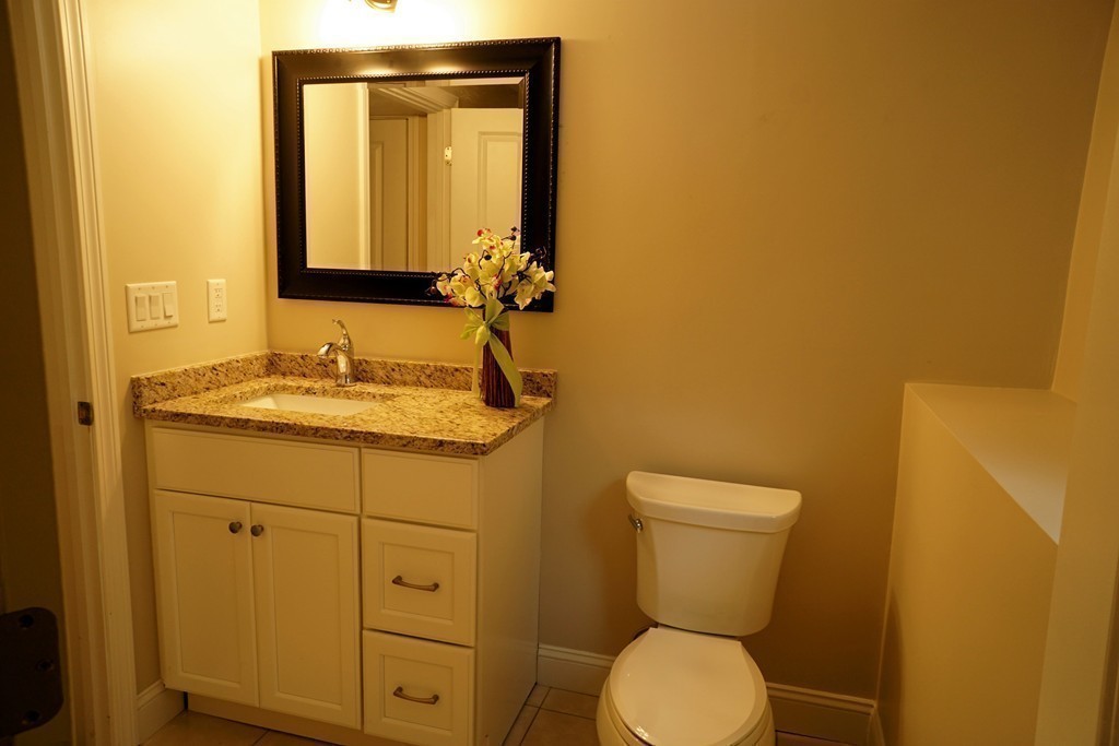 38 Blanchard Road Wilmington, MA 01887 - Photo 18 of 21 a bathroom with a toilet sink and mirror