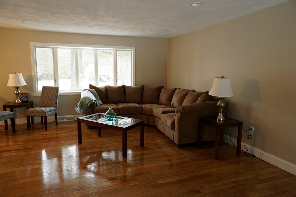 38 Blanchard Road Wilmington, MA 01887 - Photo 9 of 21 a living room with furniture and a window