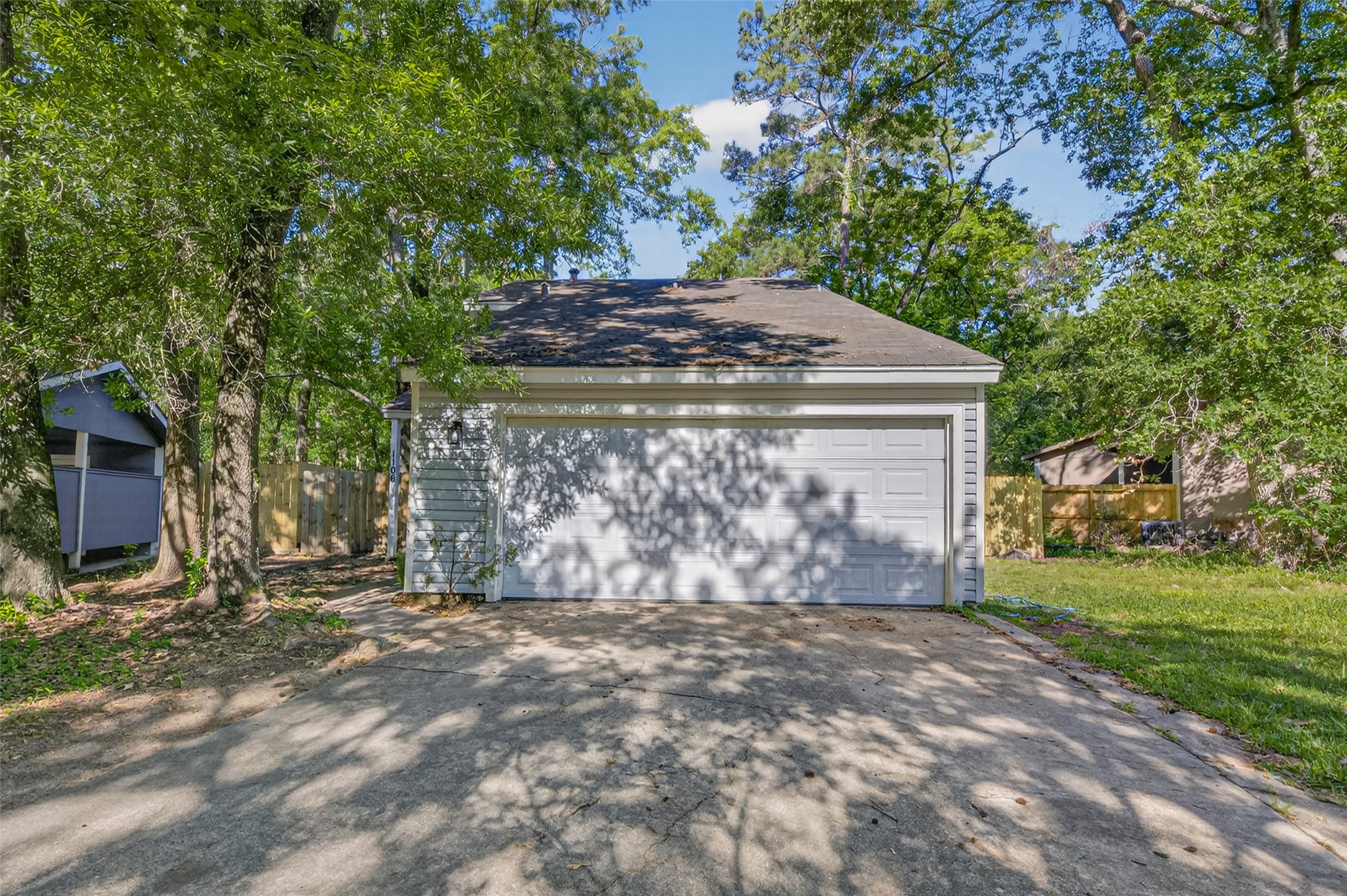 1106 East Red Cedar Circle Spring, TX 77380 - Photo 5 of 43 a view of a house with a tree