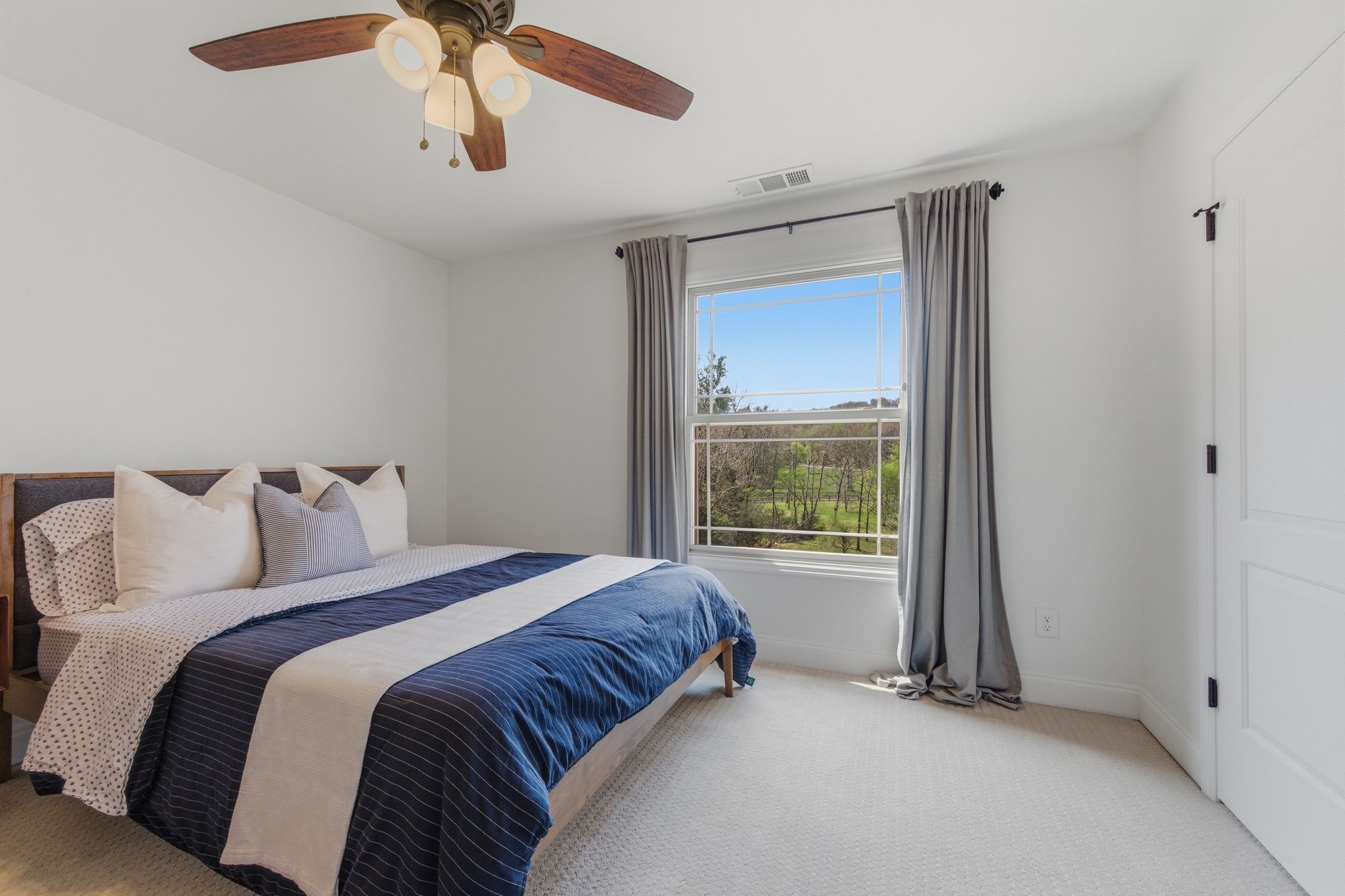 1075 Garland Hollow Road Pegram, TN 37143 - Photo 30 of 57 a bedroom with a bed and a window