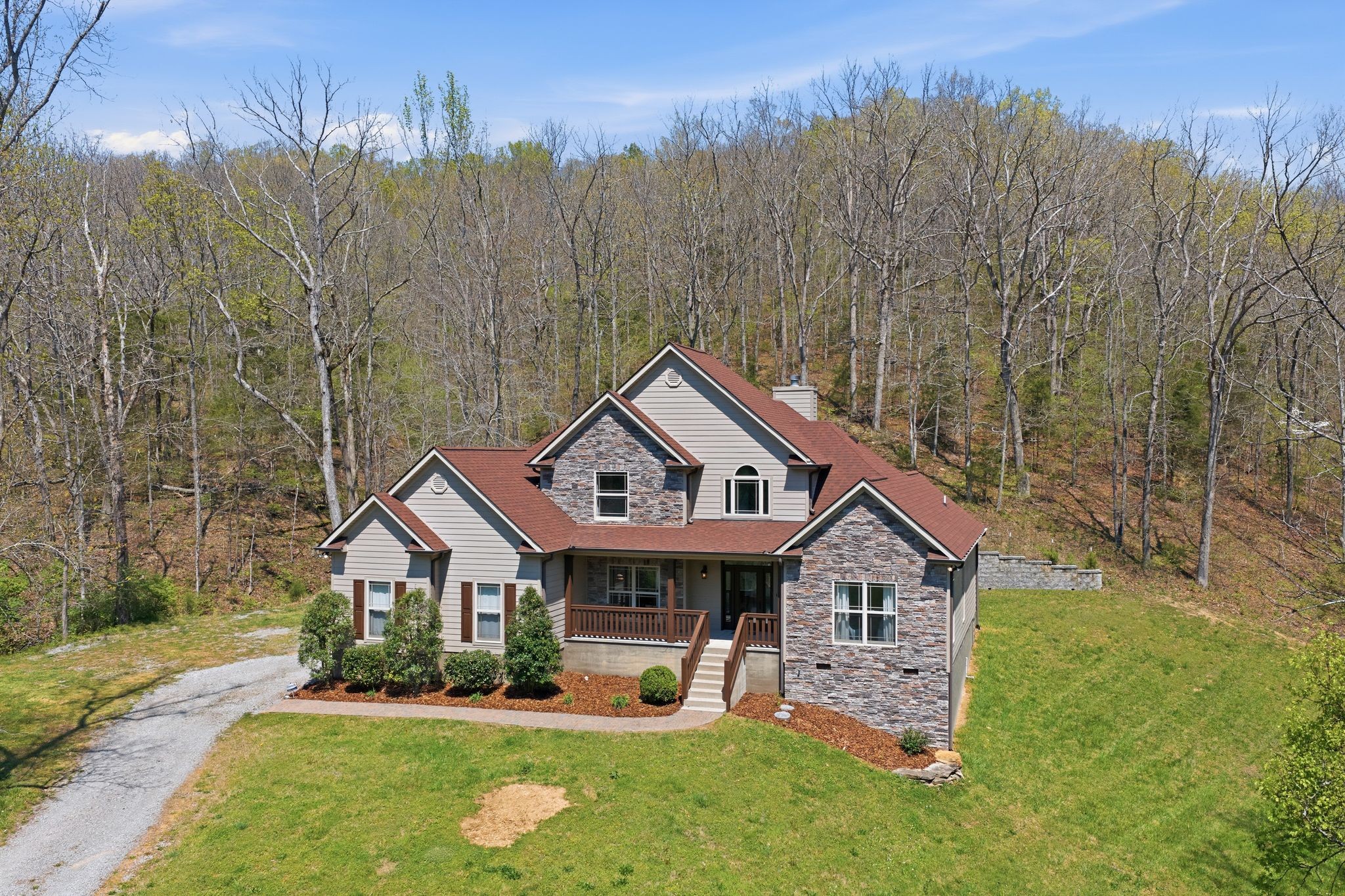1075 Garland Hollow Road Pegram, TN 37143 - Photo 3 of 57 a front view of a house with garden
