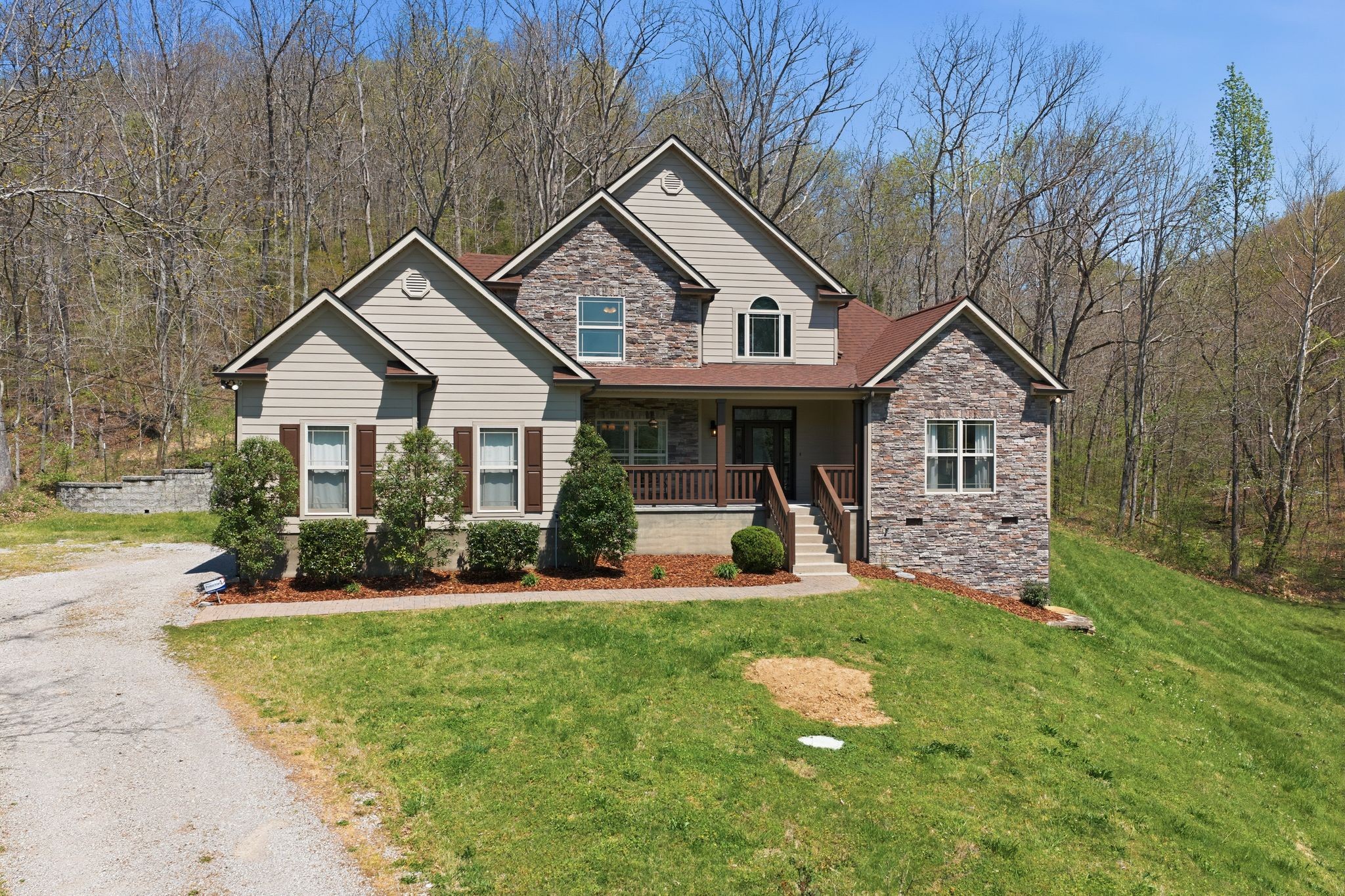 1075 Garland Hollow Road Pegram, TN 37143 - Photo 4 of 57 a front view of a house with a yard and trees