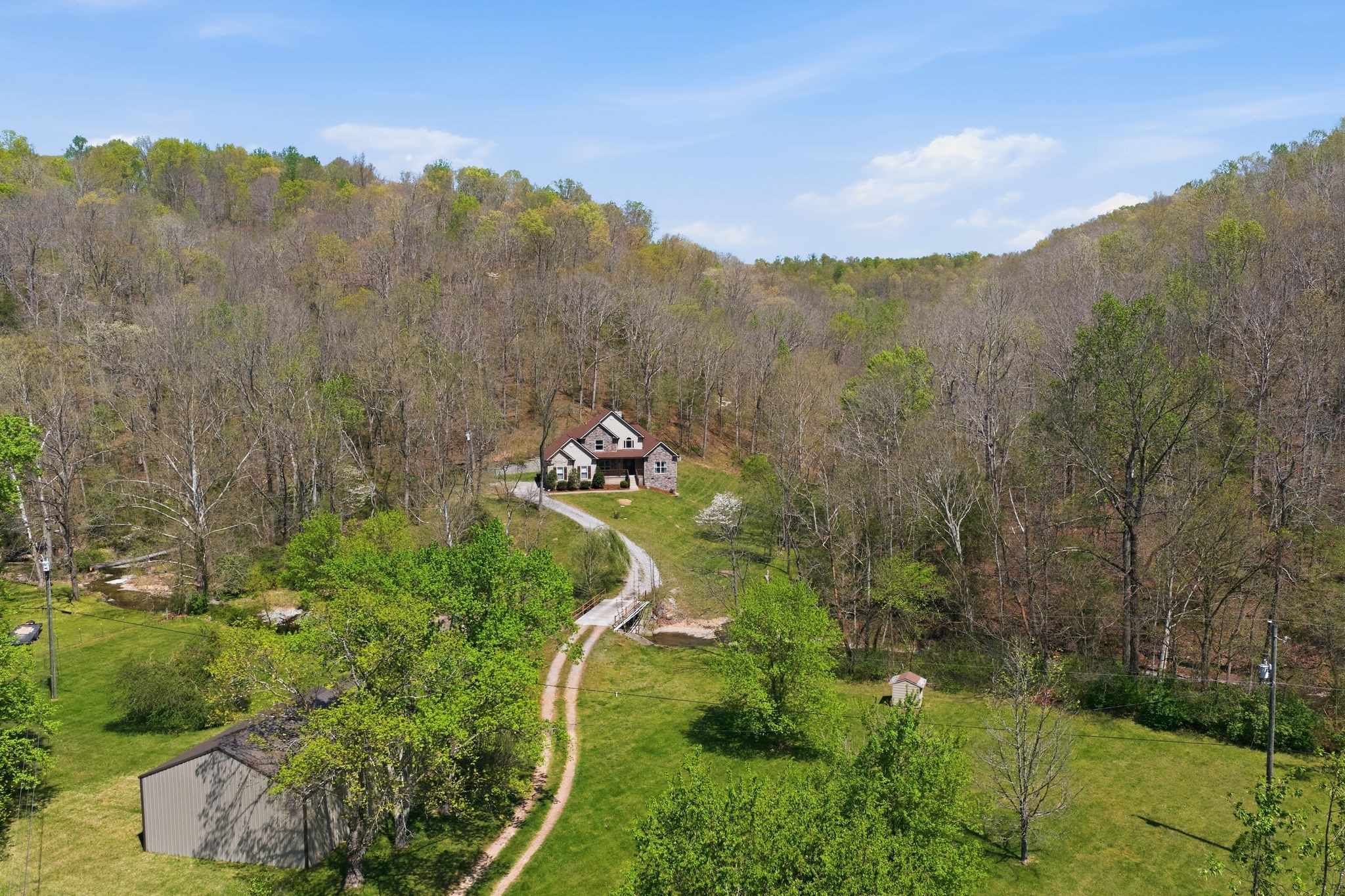 1075 Garland Hollow Road Pegram, TN 37143 - Photo 43 of 57 a view of a lake with a mountain in the background