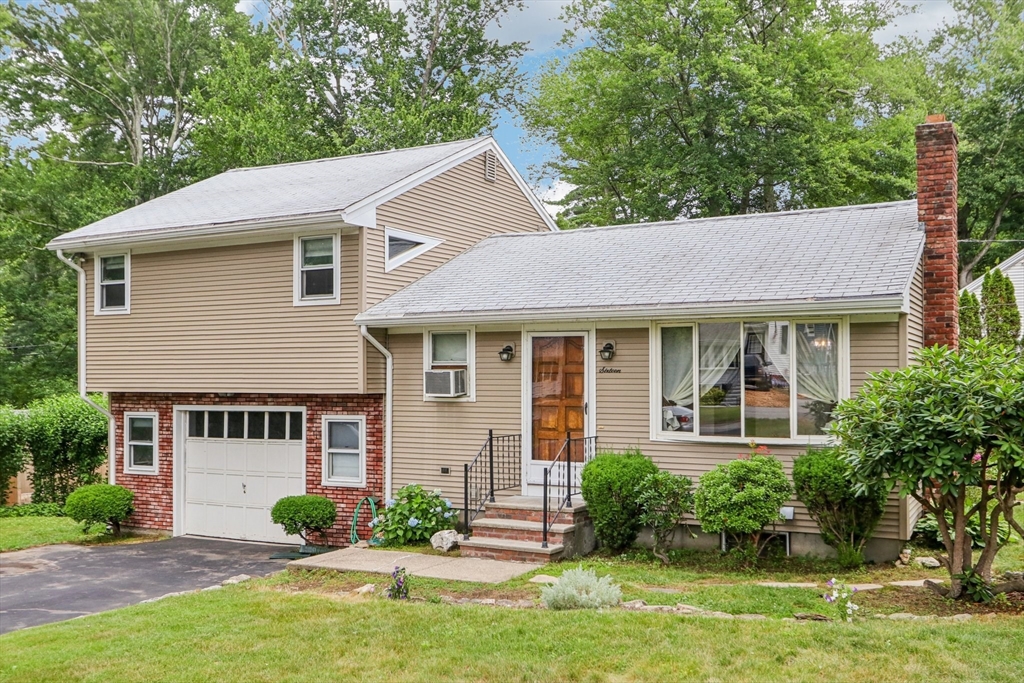 16 Indian Run Road Bellingham, MA 02019 - Photo 1 of 34 a front view of a house with a yard and potted plants