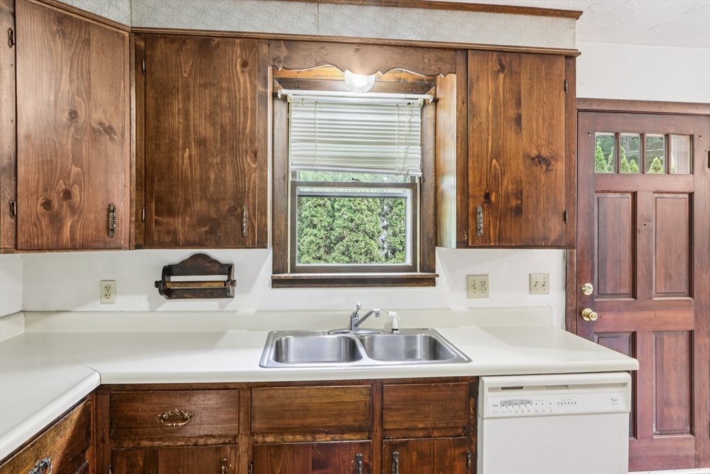 16 Indian Run Road Bellingham, MA 02019 - Photo 11 of 34 a bathroom with a sink and a mirror