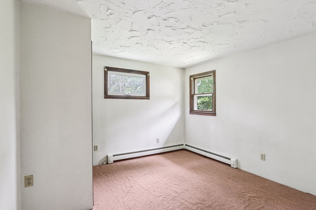 16 Indian Run Road Bellingham, MA 02019 - Photo 15 of 34 an empty room with a hallway