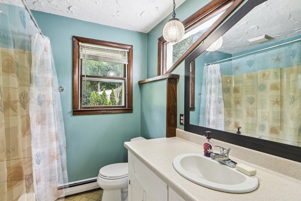 16 Indian Run Road Bellingham, MA 02019 - Photo 17 of 34 a bathroom with a sink and a mirror